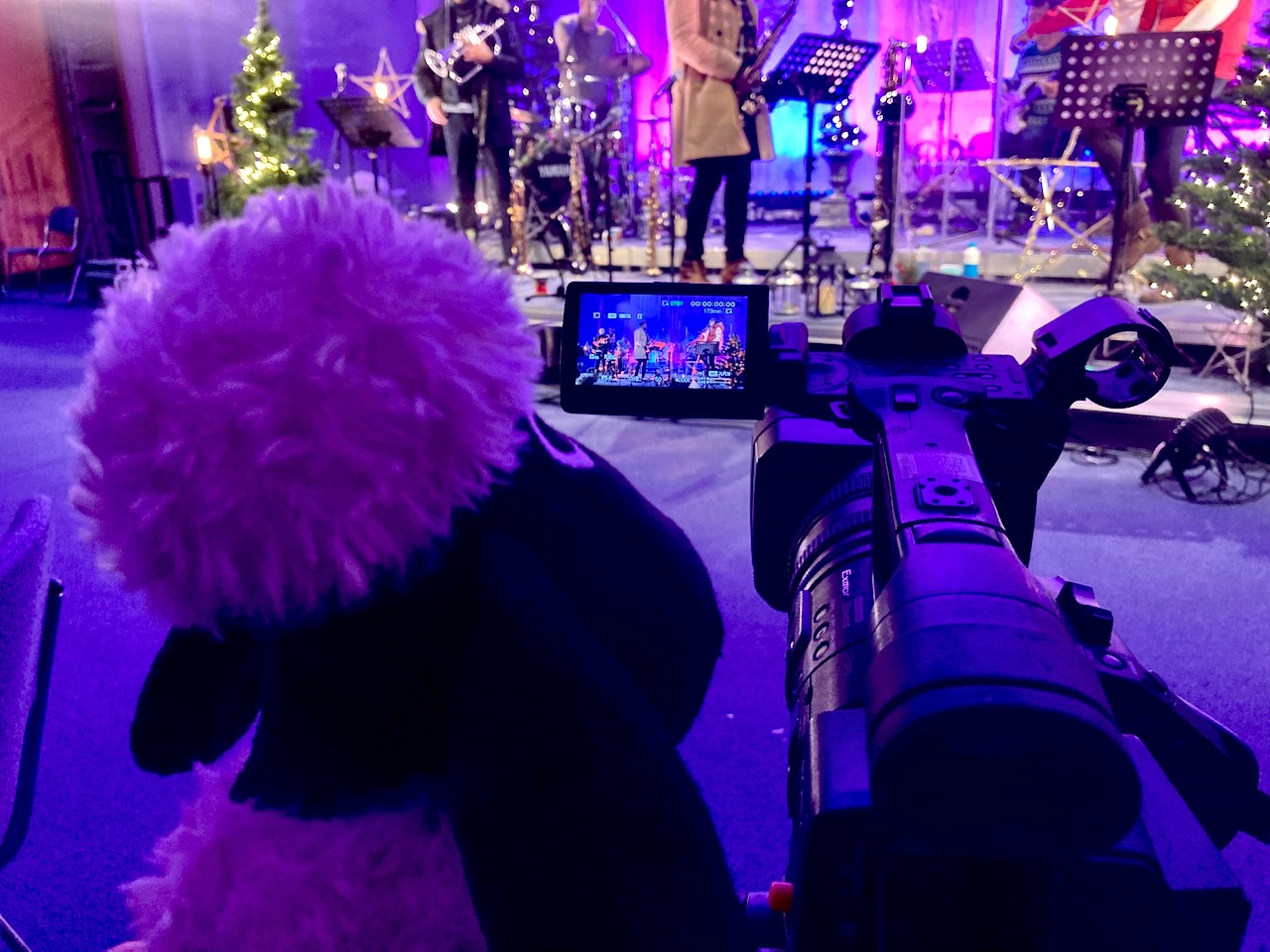 Video camera filming The Roots of Jazz band on stage