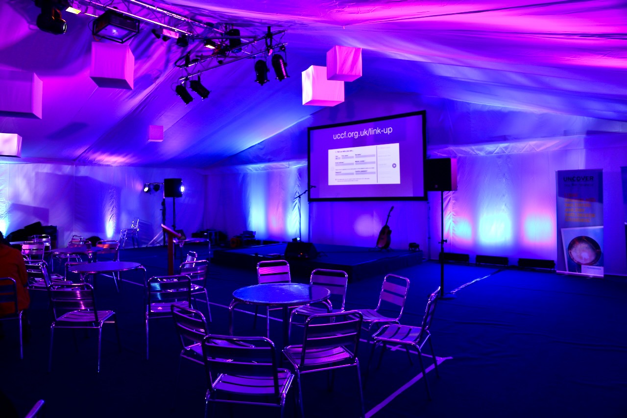 Stage pre-set with cyan and purple lighting